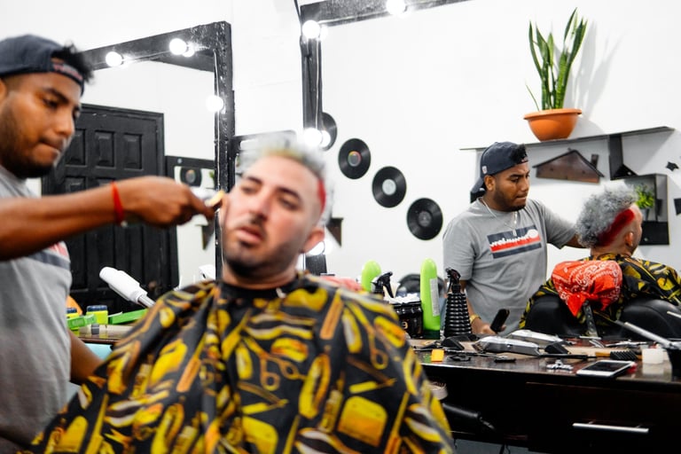 Barbers cutting hair